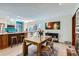 Light and bright dining area featuring a modern light fixture and views to the kitchen at 8820 W 80Th Dr, Arvada, CO 80005