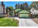Charming single-Gathering home with a two-car garage, manicured lawn, and beautiful landscaping at 8820 W 80Th Dr, Arvada, CO 80005