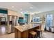 Bright kitchen with an island, granite countertops, stainless steel appliances and ample cabinet space at 8820 W 80Th Dr, Arvada, CO 80005