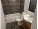 Bathroom with dark tile accents, a bathtub, and a vanity with a white sink at 16032 E Floyd Ave, Aurora, CO 80013