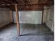 Spacious garage with white doors and concrete floors, ready for parking and storage at 16032 E Floyd Ave, Aurora, CO 80013