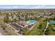 Aerial shot showcasing a community pool, amenities, parking, and green spaces in a residential neighborhood setting at 292 S Pembrook St, Castle Rock, CO 80104