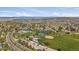 Aerial view showcases a large community park with a pool, tennis courts, and green spaces in a residential neighborhood at 292 S Pembrook St, Castle Rock, CO 80104