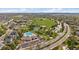 Aerial view showcasing community amenities, pool, park, tennis courts, and baseball fields nestled in a residential area at 292 S Pembrook St, Castle Rock, CO 80104