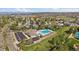 Aerial community view highlighting a swimming pool, parking, and neighborhood amenities with residential surroundings at 292 S Pembrook St, Castle Rock, CO 80104