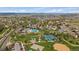 This aerial view showcases neighborhood amenities featuring pool, tennis courts, baseball field, green spaces, and parking at 292 S Pembrook St, Castle Rock, CO 80104