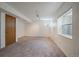Spacious basement area with neutral carpeting, a door, a window, and recessed lighting at 292 S Pembrook St, Castle Rock, CO 80104