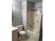 Bathroom with tub, shower, tiled walls, toilet, and vanity with sink at 292 S Pembrook St, Castle Rock, CO 80104