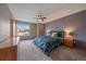 Comfortable bedroom showcasing a ceiling fan, and a large window that allows natural light to illuminate the space at 292 S Pembrook St, Castle Rock, CO 80104