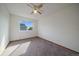 Bedroom featuring carpet flooring, a ceiling fan, and a window with a view of the neighborhood at 292 S Pembrook St, Castle Rock, CO 80104
