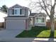 Charming home featuring a well-manicured lawn, inviting entrance, and an attached two car garage at 292 S Pembrook St, Castle Rock, CO 80104
