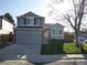 Charming two-story home featuring a well-maintained lawn, attached garage, and inviting curb appeal at 292 S Pembrook St, Castle Rock, CO 80104