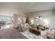Staged living room with 2 couches, neutral walls, modern decor and carpeting at 292 S Pembrook St, Castle Rock, CO 80104