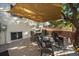 Spacious back deck shaded with a large sun shade, seating area, and well-maintained at 5060 W 71St Pl, Westminster, CO 80030