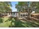 Landscaped backyard featuring a deck, shed, garden area and a well-maintained lawn at 5060 W 71St Pl, Westminster, CO 80030