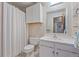 Bathroom featuring an enclosed shower, white cabinets, and a matching white vanity at 5060 W 71St Pl, Westminster, CO 80030