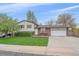 Charming split-level home with a well-manicured lawn and two-car garage at 5060 W 71St Pl, Westminster, CO 80030