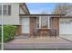 Inviting front porch with seating area and decorative front door at 5060 W 71St Pl, Westminster, CO 80030