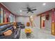 Living room featuring a comfortable leather sofa and staircase access to the main level at 5060 W 71St Pl, Westminster, CO 80030