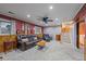 Living room featuring a comfortable leather sofa and a ceiling fan at 5060 W 71St Pl, Westminster, CO 80030