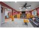 Finished basement area with a fireplace and custom built-in shelving and storage at 5060 W 71St Pl, Westminster, CO 80030