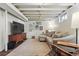 Finished basement living area showcases a comfortable couch, wood furniture, and carpet at 1395 S Kendall St, Lakewood, CO 80232