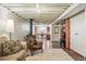 Finished basement features a living area with a wood burning stove and an office area at 1395 S Kendall St, Lakewood, CO 80232