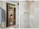 Tiled shower and open view of an unfinished area of the home at 1395 S Kendall St, Lakewood, CO 80232