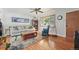 Inviting living room features hardwood floors, a comfortable sofa, and plenty of natural light at 1395 S Kendall St, Lakewood, CO 80232