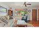 Relaxing living room with cozy seating, warm lighting, and a view to the outdoors at 1395 S Kendall St, Lakewood, CO 80232