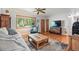 Spacious living room with comfortable seating, hardwood floors, and a view of the outdoors at 1395 S Kendall St, Lakewood, CO 80232