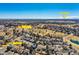 Aerial view of neighborhood near Ranch Country Club with downtown Denver in the distance at 11892 Vallejo St, Denver, CO 80234