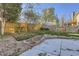 Fenced backyard featuring lush grass, rock landscaping, and a play structure at 11892 Vallejo St, Denver, CO 80234