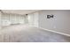 Finished basement featuring neutral paint, plush carpet, and built in shelving and storage space at 11892 Vallejo St, Denver, CO 80234