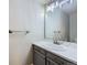 Bathroom with a single sink vanity, modern faucet, and granite countertop at 11892 Vallejo St, Denver, CO 80234