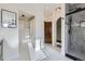 Bathroom featuring luxurious shower and walk-in closet with plenty of shelving at 11892 Vallejo St, Denver, CO 80234