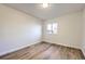 Empty bedroom with light hardwood floors and a window at 11892 Vallejo St, Denver, CO 80234