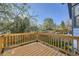 Wooden deck features a wooden fence surround overlooking a landscaped yard and mature trees at 11892 Vallejo St, Denver, CO 80234