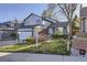 Charming two-story home with landscaped front yard and inviting curb appeal at 11892 Vallejo St, Denver, CO 80234