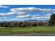View of the community golf course with manicured lawns and mountain views at 11892 Vallejo St, Denver, CO 80234