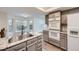 Kitchen with granite countertops, stainless steel sink, and modern appliances at 11892 Vallejo St, Denver, CO 80234