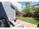 Beautiful backyard featuring a patio with a fire pit and lush lawn at 13777 W Amherst Way, Lakewood, CO 80228