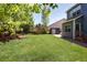 Large, green backyard with privacy fence and shed, perfect for outdoor activities at 13777 W Amherst Way, Lakewood, CO 80228