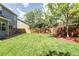 Spacious backyard with a well-maintained lawn, privacy fence, and room for outdoor entertaining at 13777 W Amherst Way, Lakewood, CO 80228