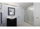 Bathroom featuring a single sink vanity and a shower with sliding glass doors at 13777 W Amherst Way, Lakewood, CO 80228