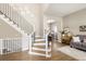 Elegant staircase and open layout showcasing the home's modern design and flow at 13777 W Amherst Way, Lakewood, CO 80228