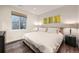 Cozy bedroom with a queen bed, natural light, and contemporary decor at 427 Milwaukee St, Denver, CO 80206