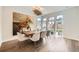 Elegant dining room with hardwood floors, modern light fixture, and bright natural light at 427 Milwaukee St, Denver, CO 80206