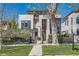 Stylish two-story home with a well-manicured lawn and modern design elements at 427 Milwaukee St, Denver, CO 80206