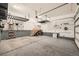 Spacious and organized garage with storage racks and a workbench area at 427 Milwaukee St, Denver, CO 80206